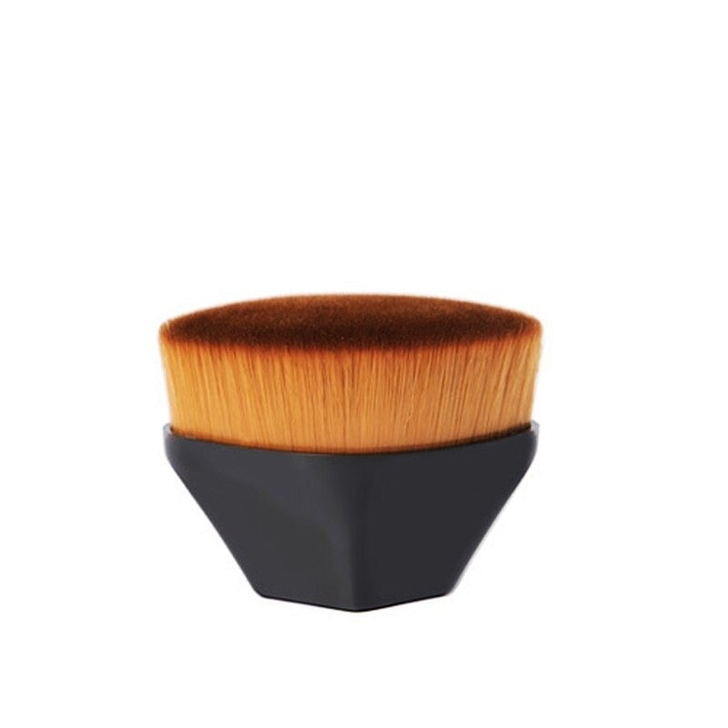 High density foundation brush with sleek black hexagonal handle and dense gradient bristles from light to dark orange