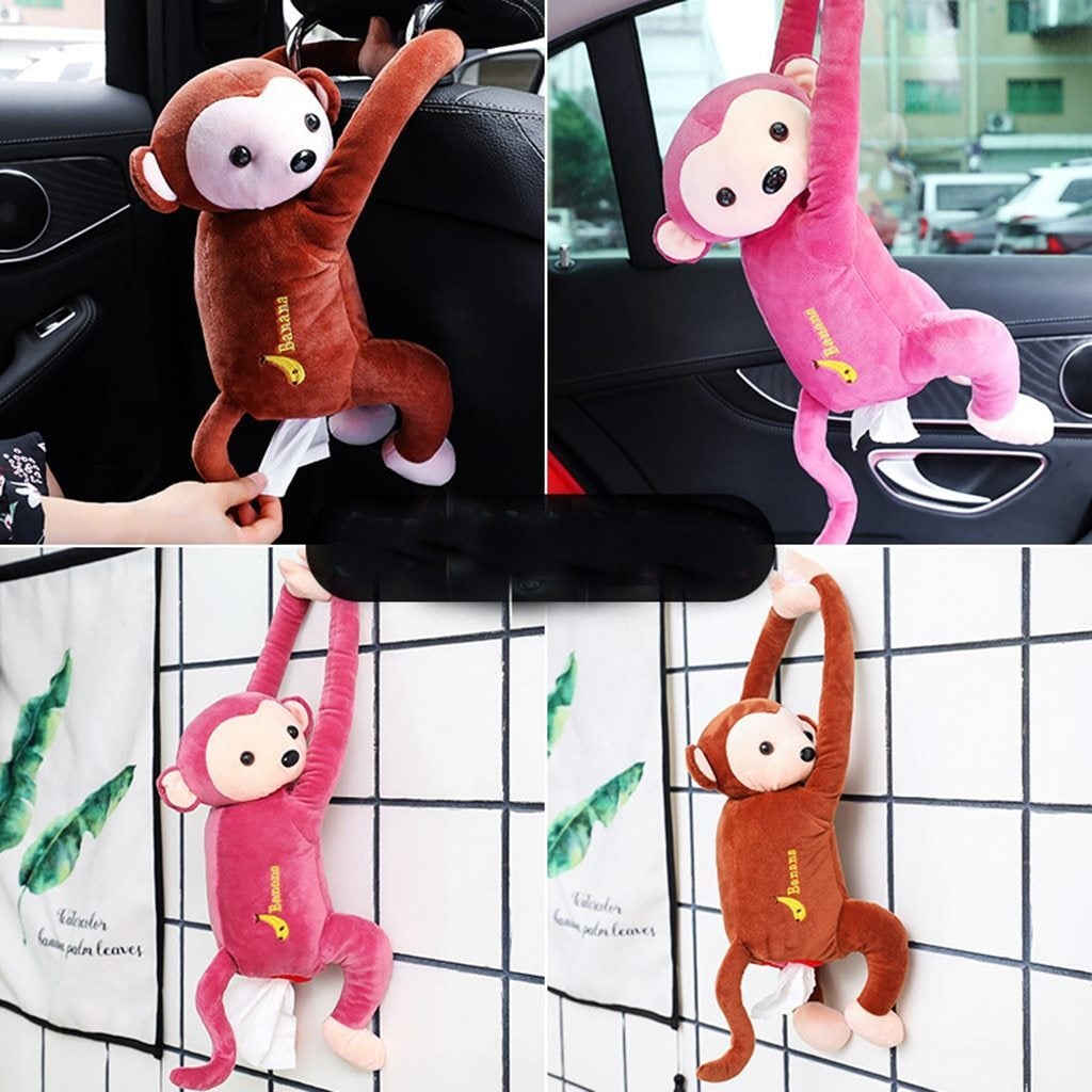 Plush hanging monkey tissue holder in brown or pink with soft fabric body embroidered details and white feet