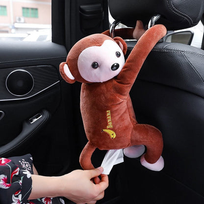Brown plush monkey car tissue holder with white face black eyes nose and embroidered yellow banana text on chest