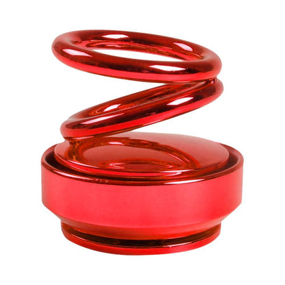 Vibrant red metallic spring car ornament with glossy finish and coiled design in auto rotation car air freshener double ring
