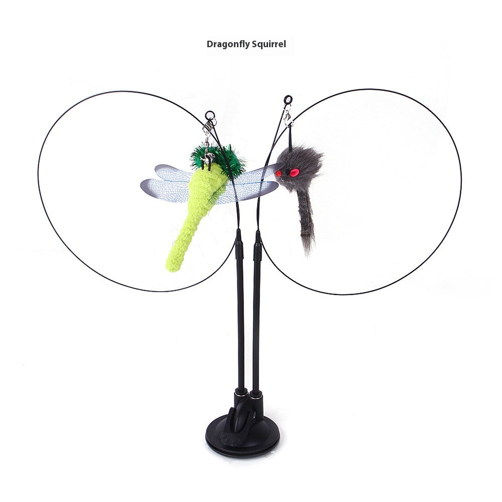 The cat sucker teaser toy features a neon green dragonfly with translucent wings and a fuzzy gray squirrel on black wire arms