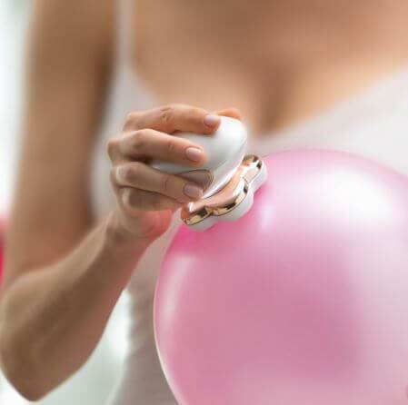 Flawless leg hair remover for women in white and rose gold heart shape with smooth glossy finish