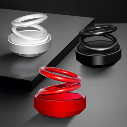 Red glossy spring-shaped auto rotation car air freshener with sleek modern double ring design for fresh scent