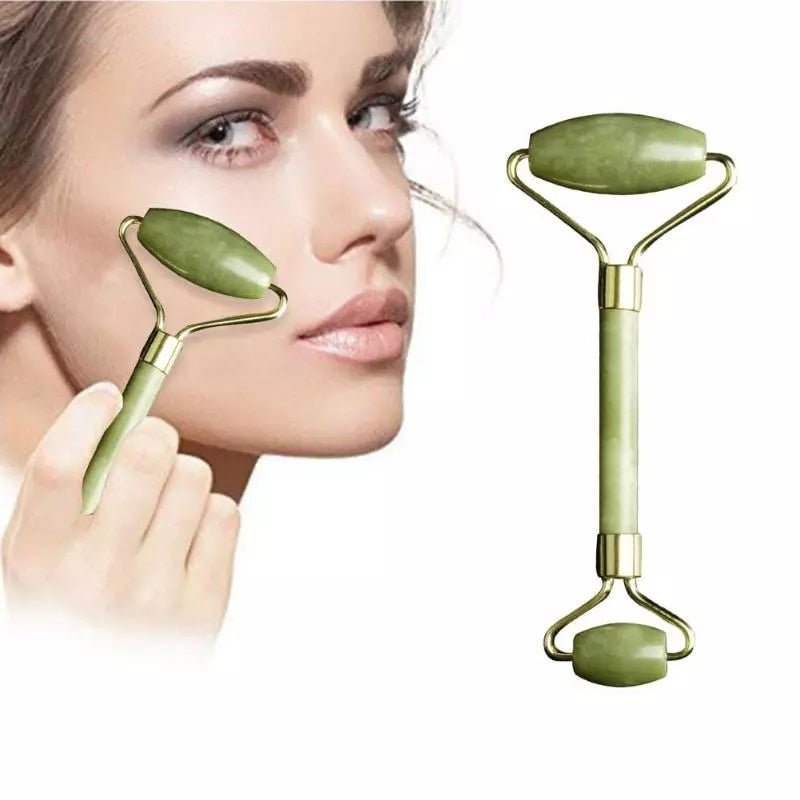 Double head jade face roller with jade green stones and gold metal frame for facial massage and skincare rituals