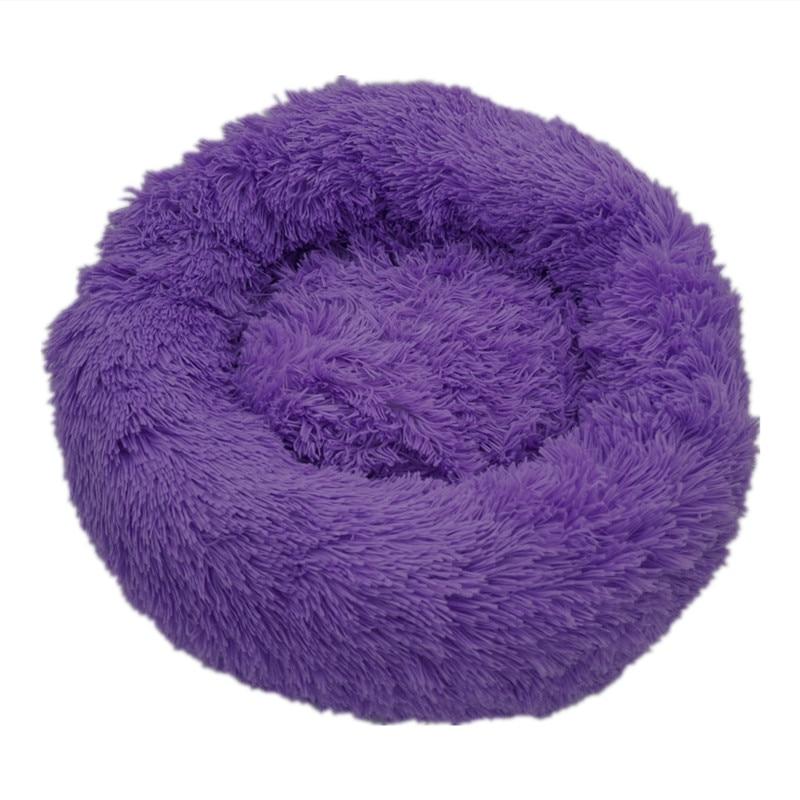 Purple fluffy calming donut bed for dogs and cats with soft plush texture and circular design