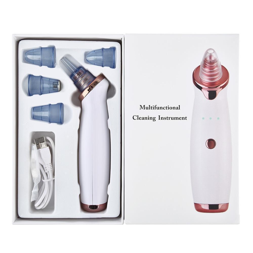 White and rose gold electric blackhead remover vacuum with interchangeable blue silicone tips for facial cleaning