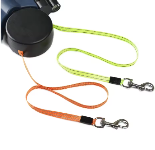 Auto double dog leash black retractable leash with lime green and orange woven straps ending in silver clasps