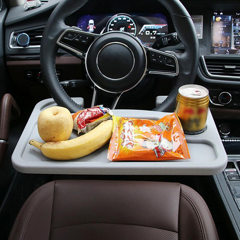 Gray plastic car steering wheel tray with smooth raised edge and built-in cup holder universal and portable design