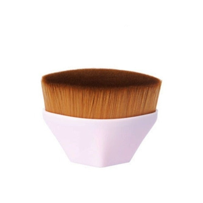 A sleek white hexagonal high density foundation brush with dense golden brown synthetic bristles for smooth application