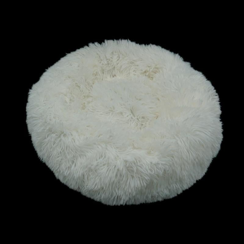 White fluffy faux fur calming donut bed for dogs and cats with round plush design for comfort and relaxation